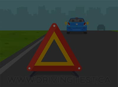 Test 1 - If something happens and your vehicle becomes disabled at night and cannot be completely moved off the roadway, where do you need to put a reflector?