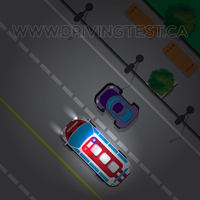 Test 3 - If you are getting passed by an emergency vehicle at night, what should you do?