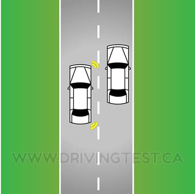 Test 1 - When should you stop accelerating while you are passing a vehicle?